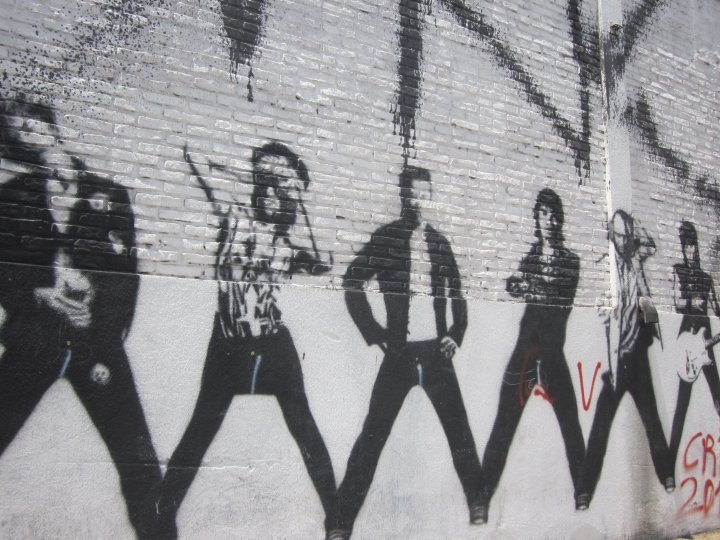 Black and white street art images of people.