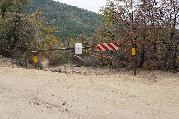 Wolf Creek Falls Trailhead is marked by a gate