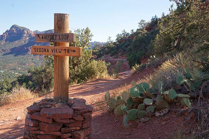 Trail intersection with trail signs to Airport Loop trail and Sedona View trail