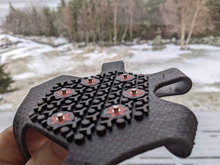 Closeup of microspike footwear traction device.