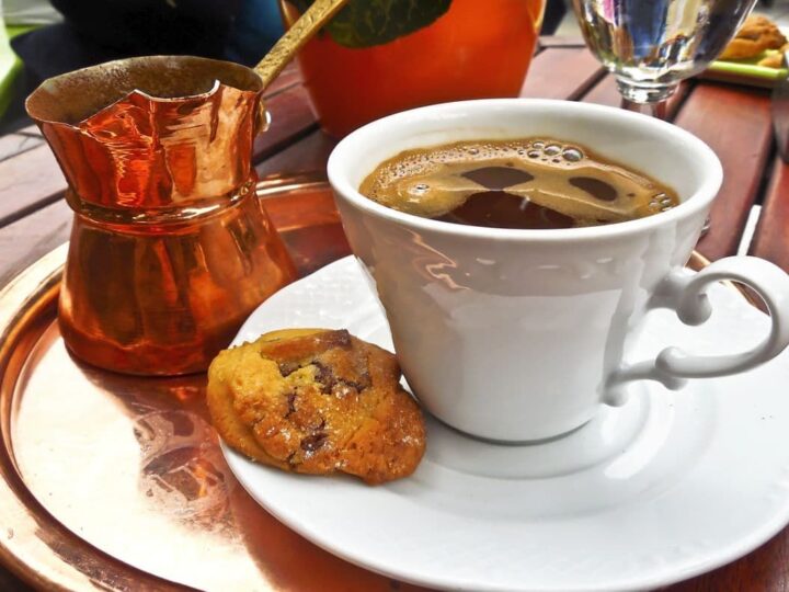 Traditional Greek coffee, cookie, and briki.