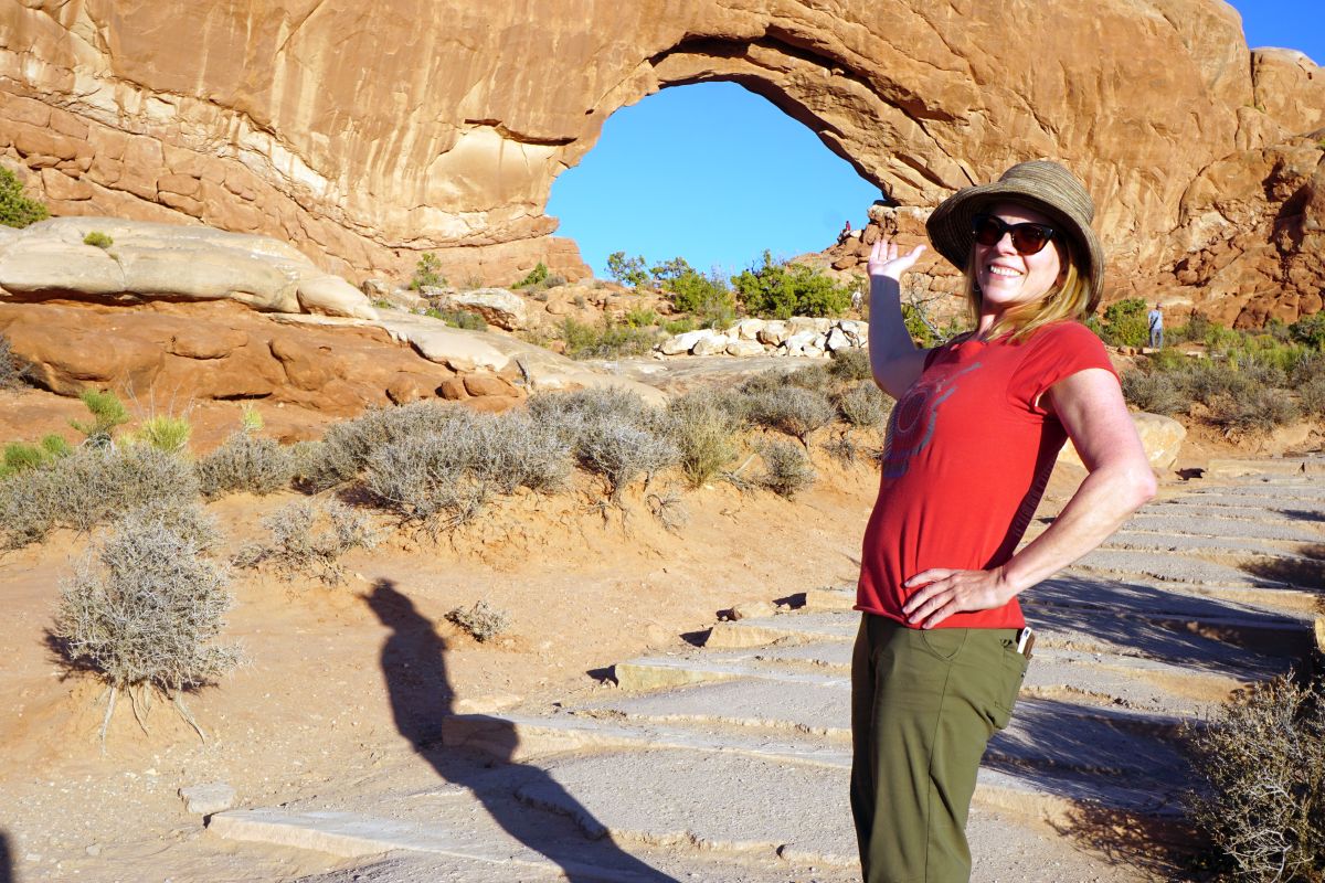 Woman standing in front of Window Arch.
