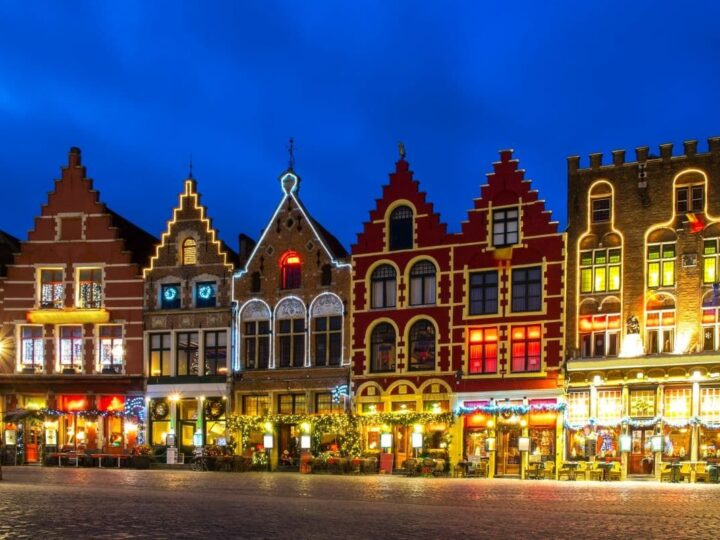 Bruges market square lit up at night.