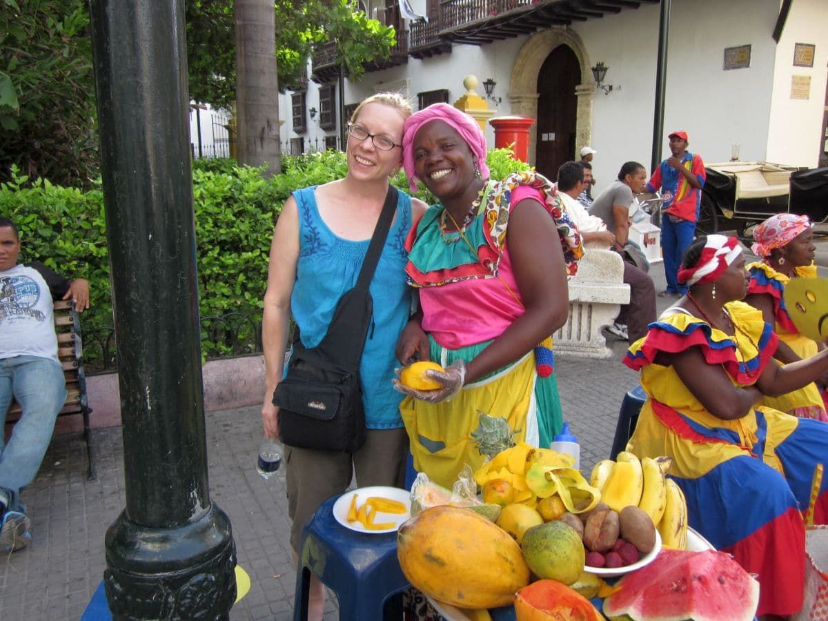 Tourist and fruit sellers in Cartagena known as las palenqueras.