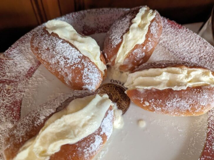 Four Maritozzi Italian desserts on a plate.