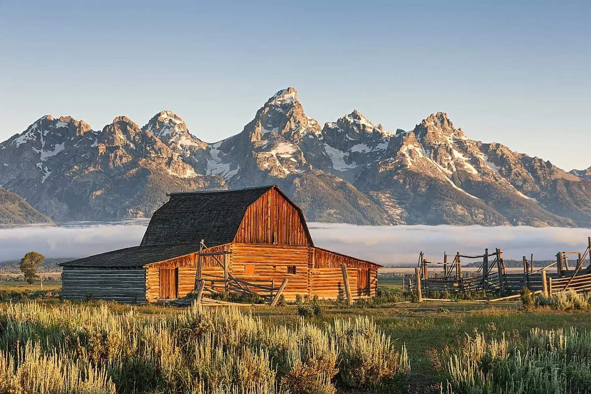 Wooden barn and Grand Teton Mountains.