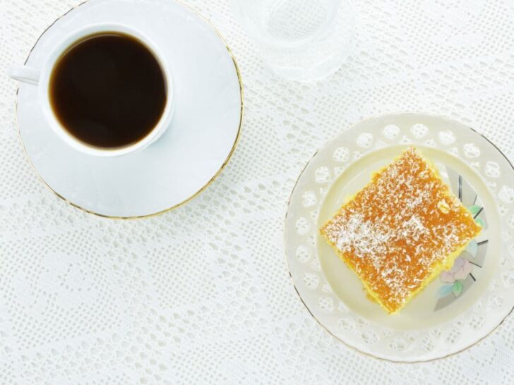 Greek dessert ravani with a cup of coffee.