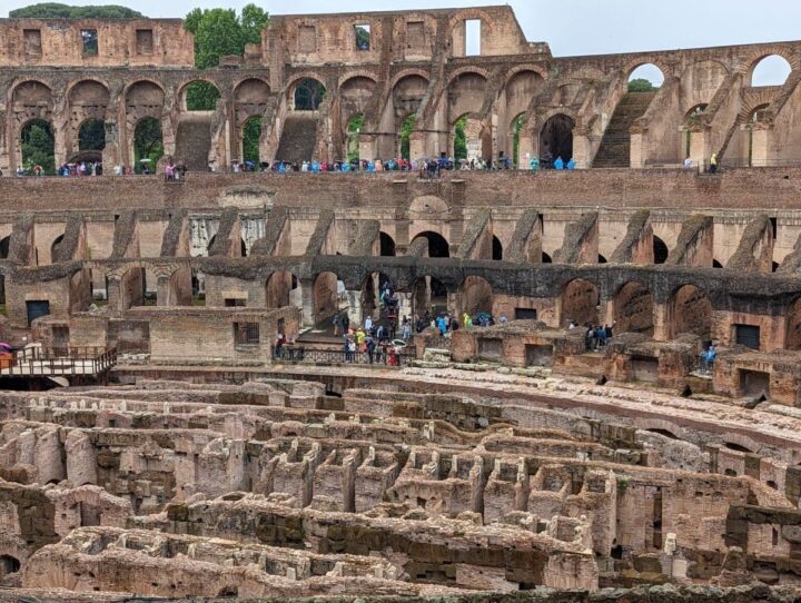 Rome Colosseum tour visitors inside the arena.