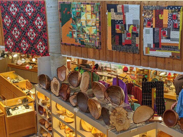 Folk Art Center shop with quilts, wooden bowls, jewelry, and gifts.