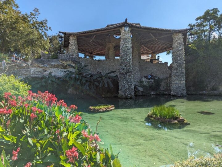 Stone pavilion next to a lily pond at Japanese Tea Garden in San Antonio.