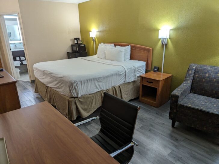 Hotel room with king-size bed at Baymont by Wyndham Amarillo East hotel.