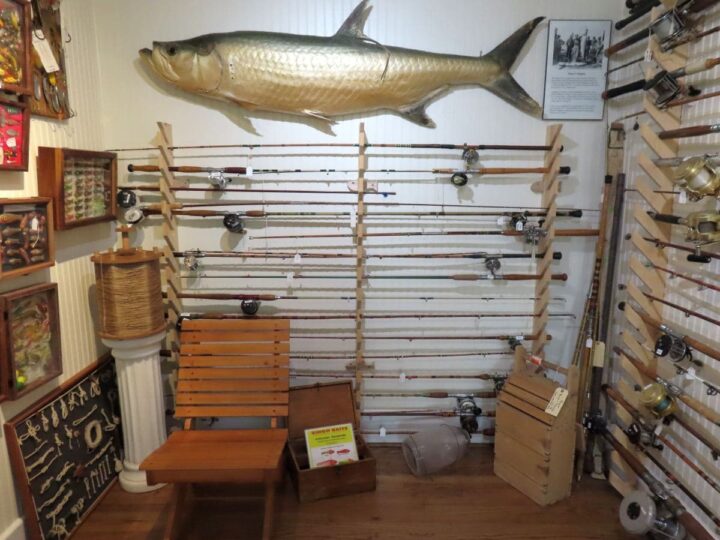 Fishing rods, reels, tackle, and a tarpon on display at Port Aransas Museum.