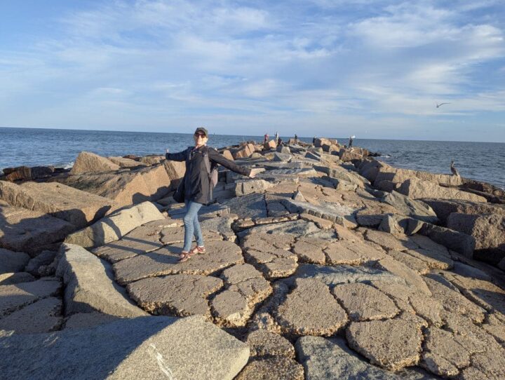 The author walking the South Jetty in Port Aransas on a warm sunny day in winter.